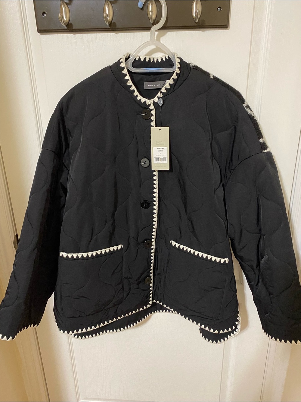 Black Quilted Jacket with White Trim -
